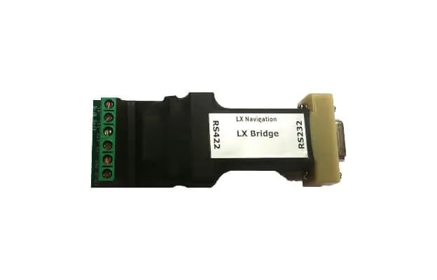 LX Bridge Becker radio bridge, a black module with a green screw terminal block and RS422 and RS232 ports
