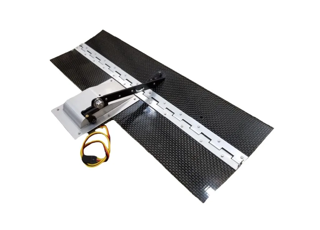 Trim tab kit: carbon-fibre tab with its servo linkage mounted on the hinge rail